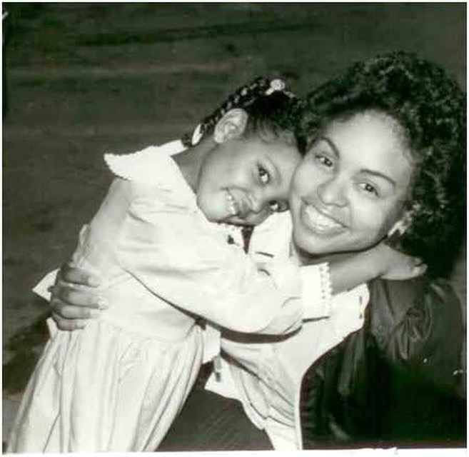 A young Izola with her mother