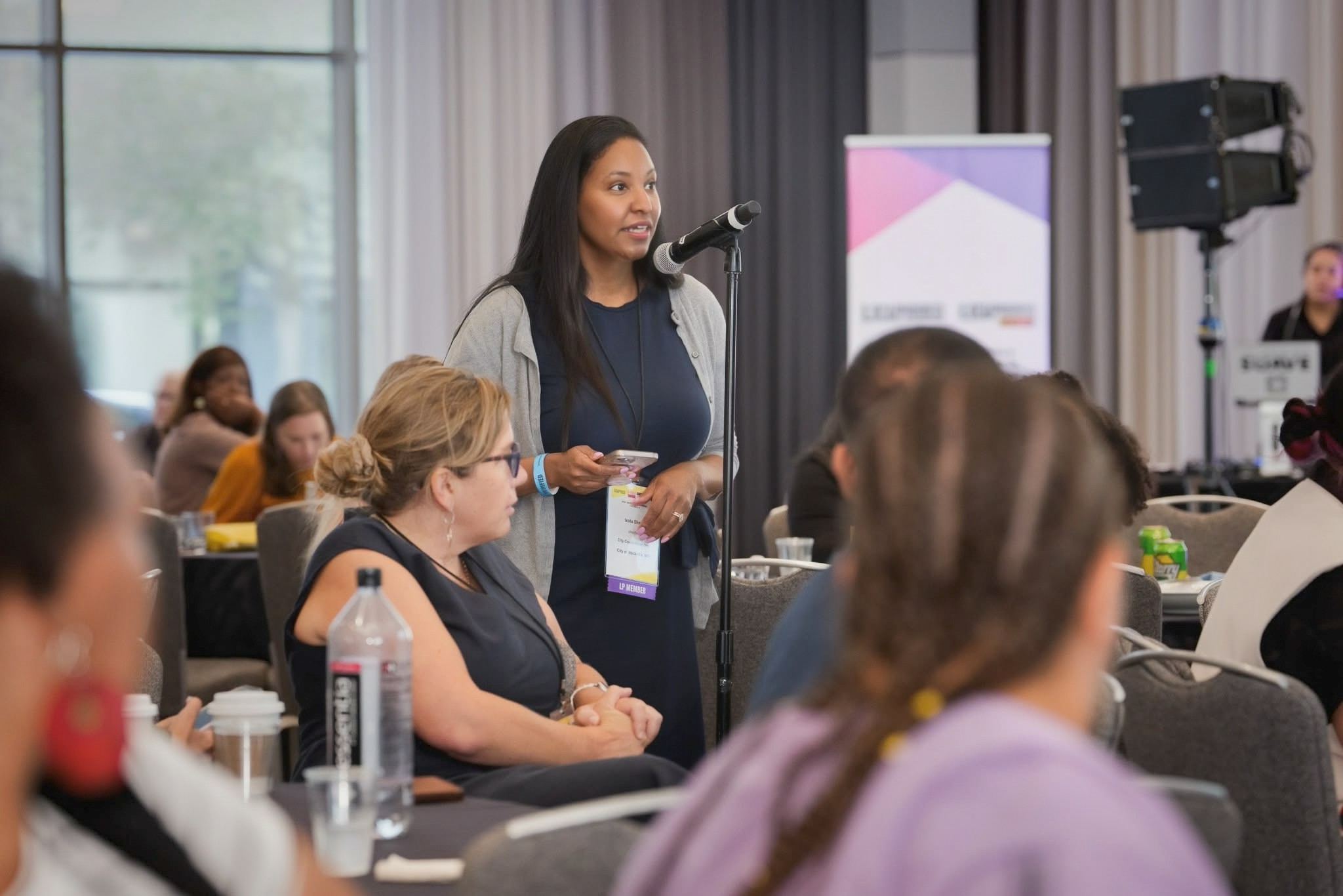Izola Shaw speaking at community event